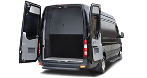 Rear view of black Mercedes Sprinter van with rear doors agape
