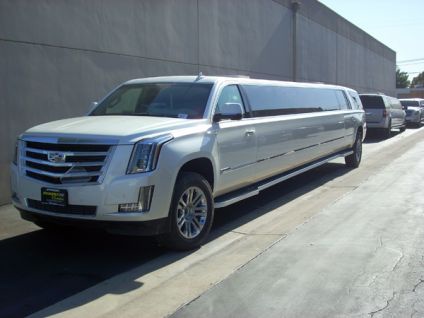 White New Cadillac Escalade SUV limousine on display